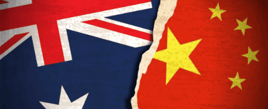 Australia and Chinese flags with tear in middle